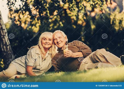 Cute Mature Partners In Spending Time In Park Stock Photo Image Of Enjoy Grass