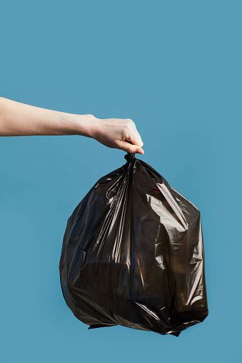 Hand Holding Black Trash Bag Stock Photo Download Image Now Istock