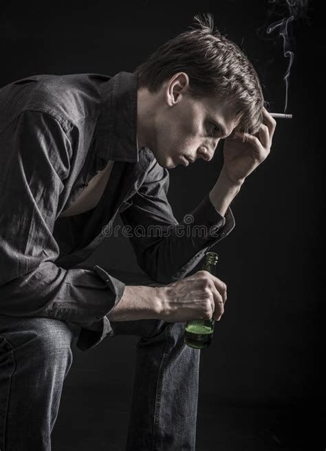 Very Depressed Man Smoking And Drinking Stock Image Image Of Despair