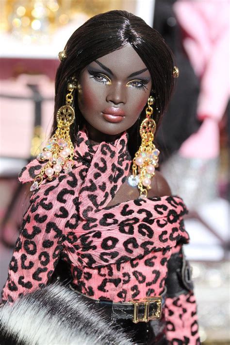 A Barbie Doll With Black Hair And Leopard Print Dress Holding A Fur Purse In Her Hand