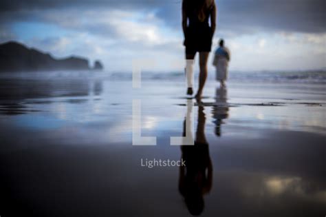 A man following jesus on a beach — Photo — Lightstock
