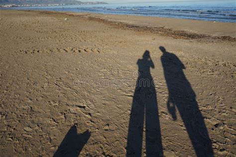 Shadows Of People On The Sandy Ground In The Beach Stock Image Image