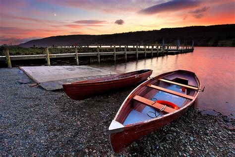 Two Brown Wooden Rowboats Docked On Lake Hd Wallpaper Wallpaper Flare