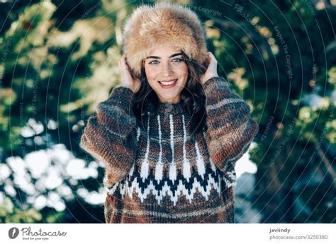 Young Woman Enjoying The Snowy Mountains In Winter A Royalty Free