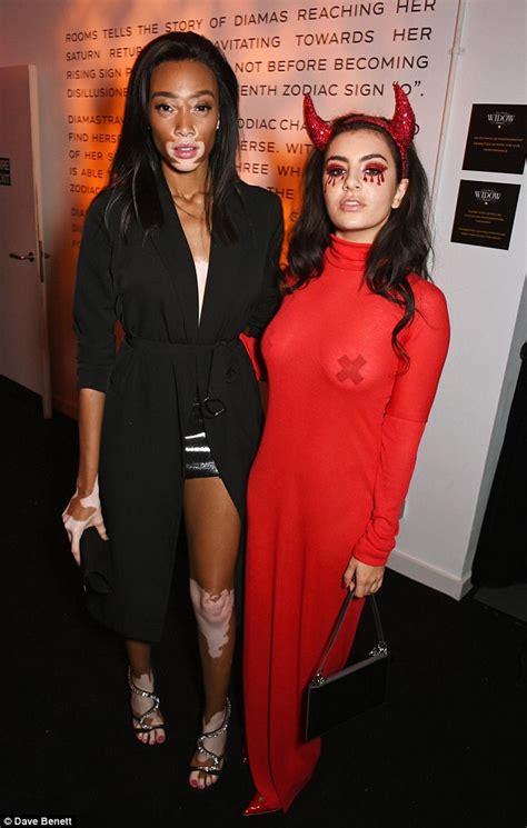charli xcx flashes her nipple pasties as she joins winnie harlow at halloween party daily mail