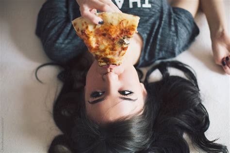 Young Woman Eating Pizza By Stocksy Contributor Jovana Rikalo Stocksy