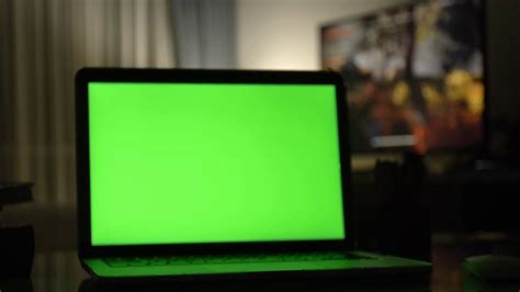 Laptop with green screen. Dark home office . Dolly shot of Perfect to ...