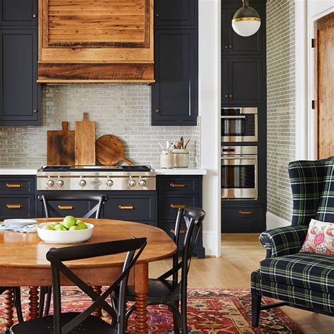 Absolutely stunning butler's pantry features navy blue cabinets adorned with brass hardware topped with thick gray and white marble countertops. Dear navy blue, I can't quit you. And this timeless ...