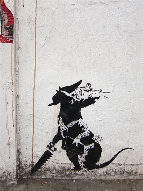 Banksy has gained his notoriety through a range of urban interventions, from modifying street signs and printing his own currency to illegally hanging his own works in institutions such as the louvre and the museum of modern art. 503(GOMARUSAN): banksy rat