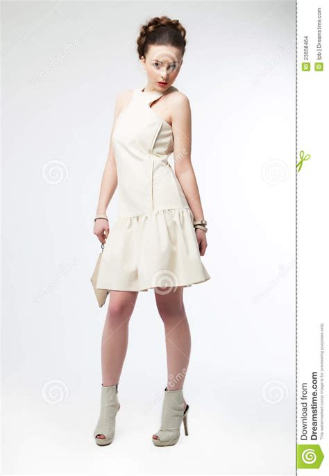 Beautiful Fashion Model Girl In White Dress Posing Stock