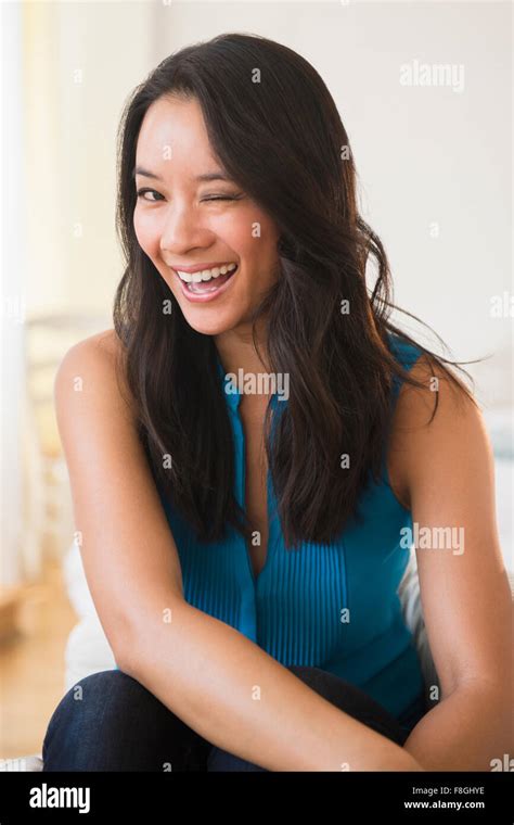 Chinese Woman Winking Stock Photo Alamy