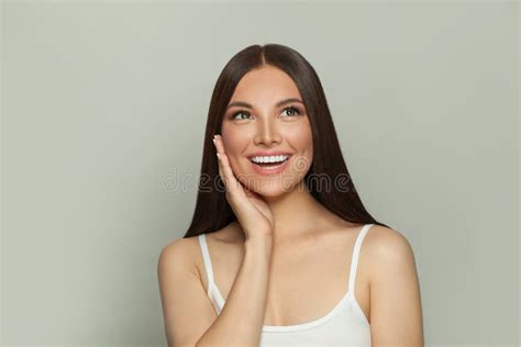 Happy Surprised Brunette Model Woman With Clear Skin And Long Healthy
