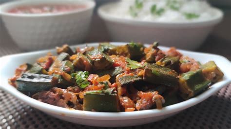 Toss in the sliced chili, dish out and serve hot. BHINDI MASALA | LADY'S FINGER MASALA RECIPE | OKRA RECIPE ...