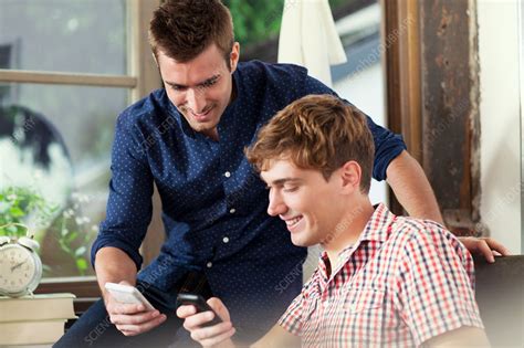 Two Young Men Using Smartphones Stock Image F0092963 Science Photo Library