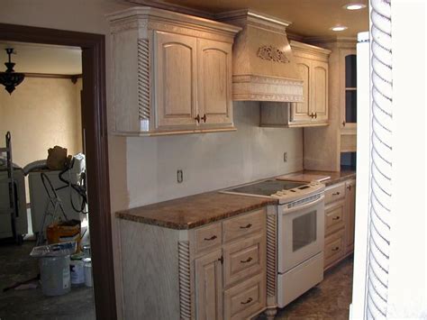It's time to update the answer: Pickled oak kitchen cabinets photos