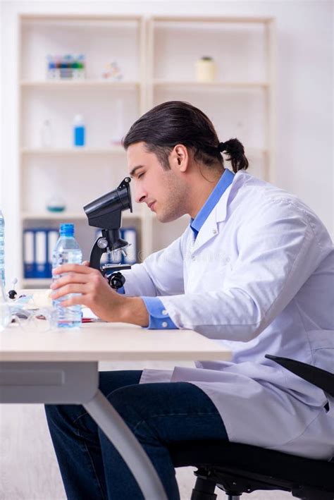 Young Male Chemist Experimenting In Lab Stock Photo Image Of