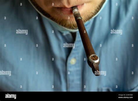 Smoking Pipe With Tobacco In Man Mouth Close Up Vintage Mouthpiece