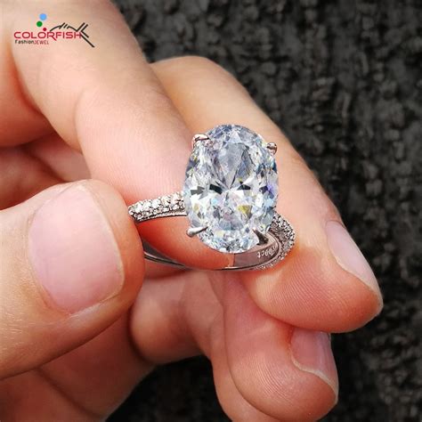This diamond shape features the same brilliant cut of a round diamond in an oblong shape, drawing attention to any hand that wears it. COLORFISH Luxury 5 Carat Oval Cut Solitaire Engagement Ring 925 Sterling Silver Rings For Women ...