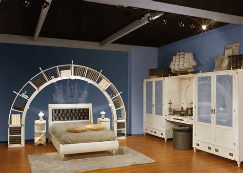 Navy blue headboard with navy blue pillows styled in a transitional bedroom beside a white nightstand featuring a baby blue urn lamp. Blue and White Sea Theme Kids Bedroom Design - Interior ...