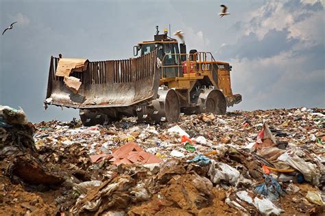 Bulldozer On A Landfill Site Photograph By Jim West Fine Art America