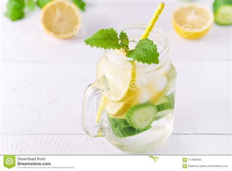 Infused Water With Lemon Cucumber And Mint On Wooden Background Detox