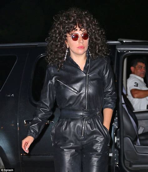 Lady Gaga Wears Black Leather Jumpsuit And Sky High Platforms As She Dons Curly Wig Daily Mail