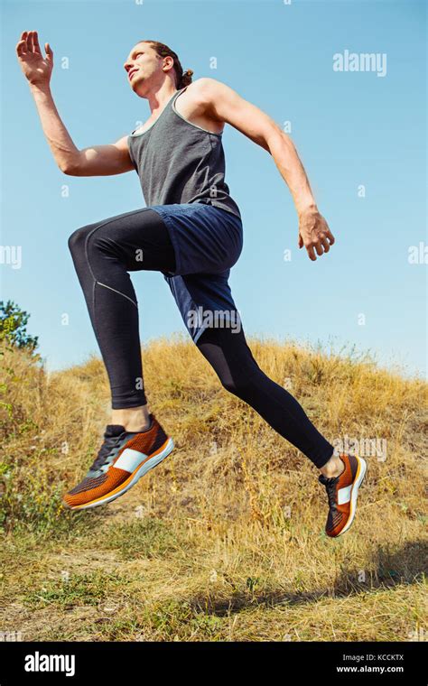 Running Sport Man Runner Sprinting Outdoor In Scenic Nature Fit