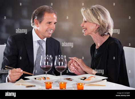 Romantic Couple Having Dinner At The Restaurant Stock Photo - Alamy