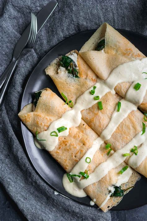 Savory Crepes With Almond Cheese Sautéed Spinach And Vegan Hollandaise