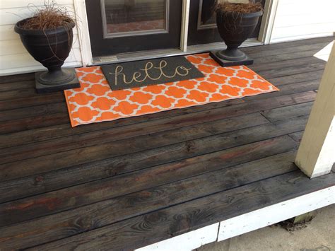 The roof needing to be extended. Front porch love! Ebony stain on front deck. Layered rug ...