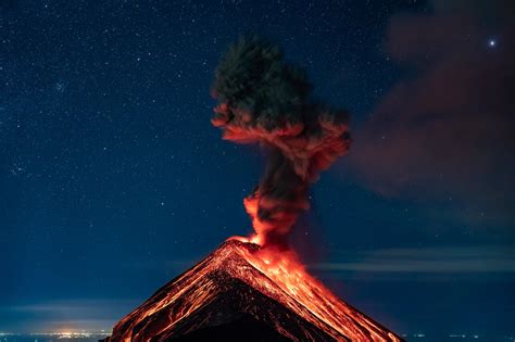 A Clear Starry Night With The Fuego Volcano Erupting In Guatemala Oc