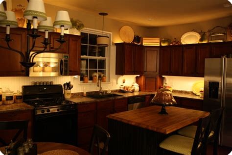 Ensure you can see well when cooking for your family and provide additional security outside of your home. Mood lighting in the kitchen from Thrifty Decor Chick