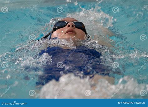 Teen Girl Swimming In A Pool During A Competition Stock Photo Image