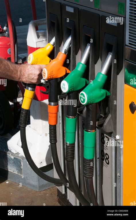 Selecting By Colour Fuel Pump At A Self Service Petrol Station Stock