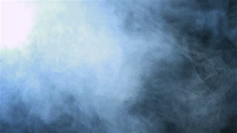 Smoke background. Abstract blue smoke cloud. Smoke in slow motion. White smoke slowly floating 