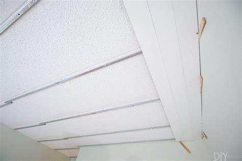 Affordable fabric coverings & led lighting for concrete ceilings. How to Cover a Popcorn Ceiling With Ceiling Planks ...