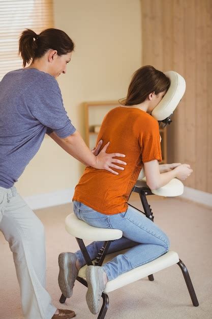 Premium Photo Young Woman Getting Massage In Chair
