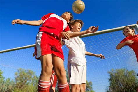 Boys Playing Soccer Stock Photo Image Of Jump Field 25104212