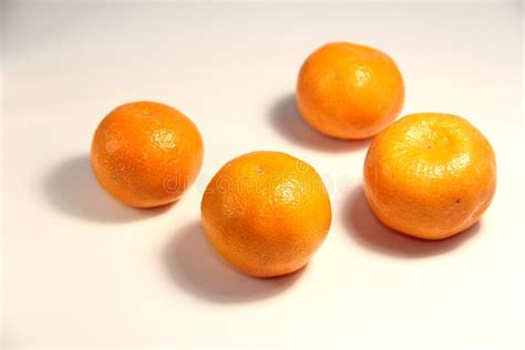 Tangerines On A White Background Four Pieces Stock Photo Image Of