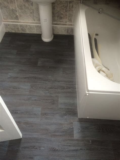 Tile effect vinyl flooring vinyl flooring rolls bathroom vinyl bathroom flooring commercial flooring outdoor furniture sets outdoor decor white this luxury vinyl flooring creates a striking black and white contrasting look that will grant a unique focal point in the room. Bathroom Flooring Laminate Tile Effect - Idalias Salon