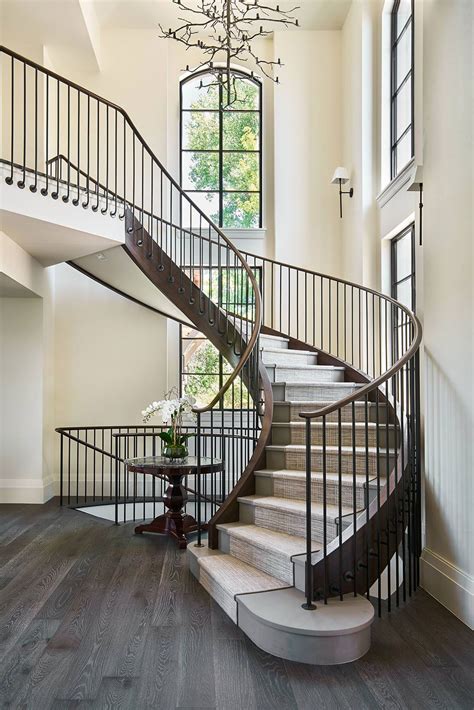 This Custom Made Curved Staircase Is Located Next To The Front Door