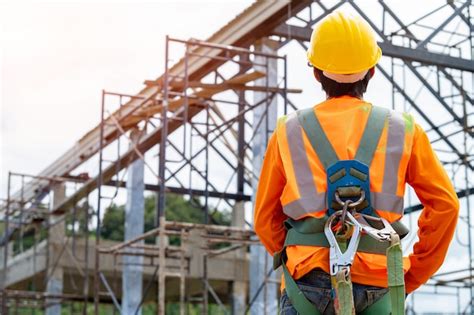 Premium Photo Construction Worker Wearing Safety Harness And Safety