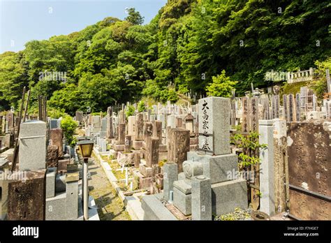 Old graves and headstones of the deceased at a Buddhist cemetery
