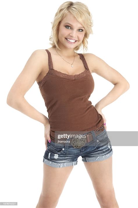 Attractive Casual Young Woman In Brown Tank Top And Shorts High Res
