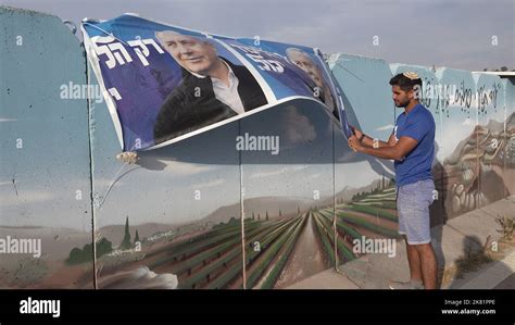 Hawara West Bank October 19 An Israeli Man Hangs An Election Campaign Banner For The Likud