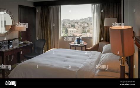 Freshly Made King Size Bed In A Cozy Hotel Bedroom With The View Of