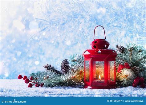 Christmas Lantern In Snow With Fir Tree Branch Winter Cozy Scene Stock