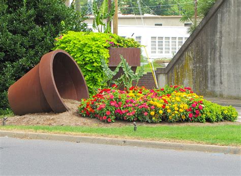 Upcycle an old, rusty ladder by adding a fresh coat of paint and a medley of planters, flower pots, and antique boxes. 30 Spilled Flower Pots To Give Your Flowers A Liquid Touch.
