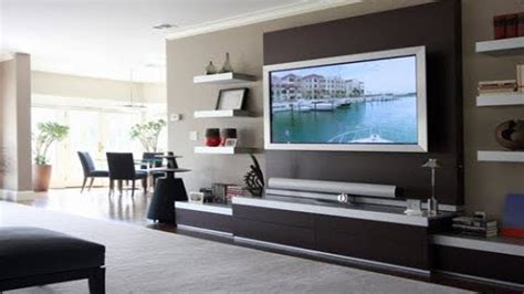 A sleek tv unit with shelves and cabinets. TV Cabinet Designs For Living Room India | TV Cabinet On ...