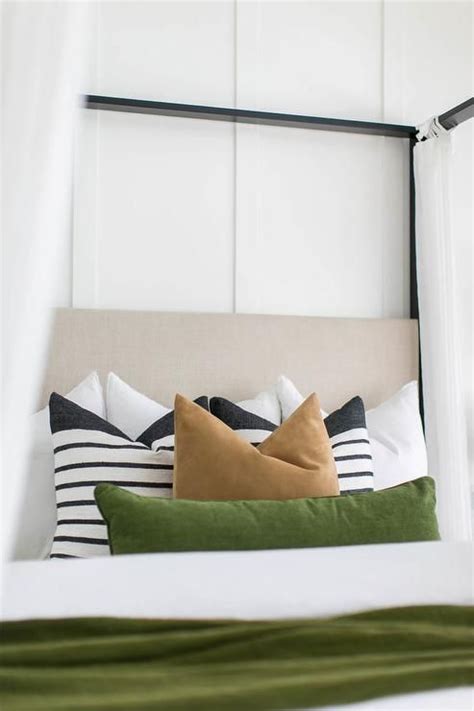 Mosquito bed nets surround any crib or nursery bed, help keep out mosquitos and other small pests while your. A black canopy bed accented with white sheer curtains and ...